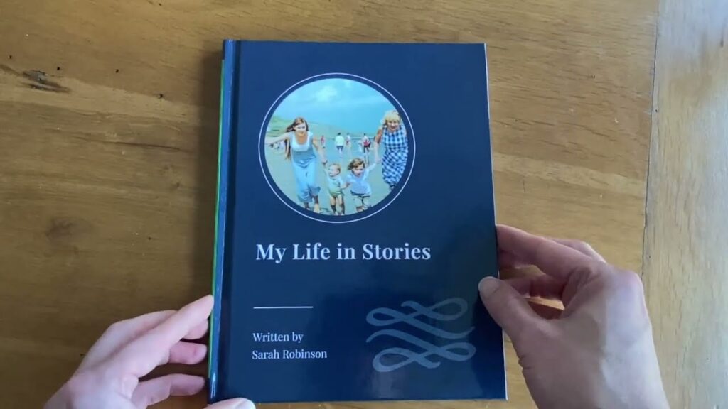 A YourStory hardback, My Life in Stories, held open to show the inside. Play the See Inside video