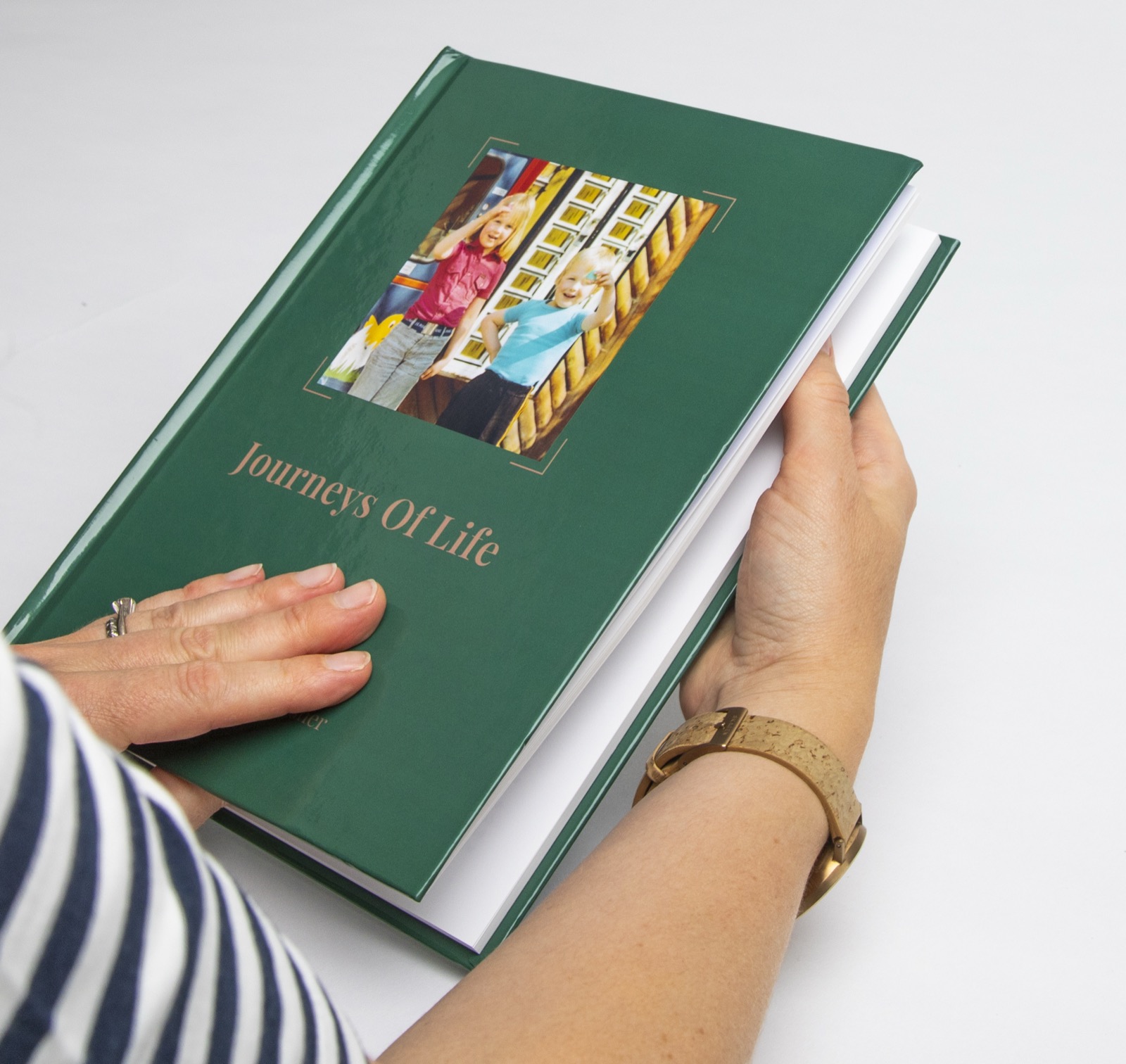 A YourStory hardback held in hands