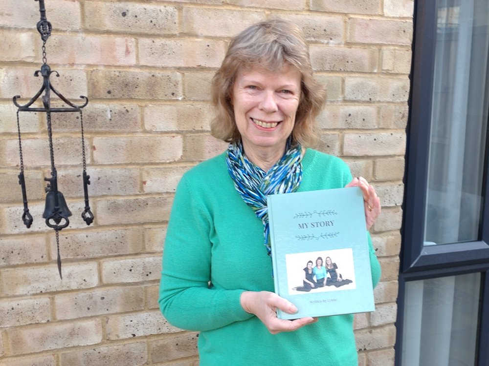 A YourStory customer holding her book, My Story